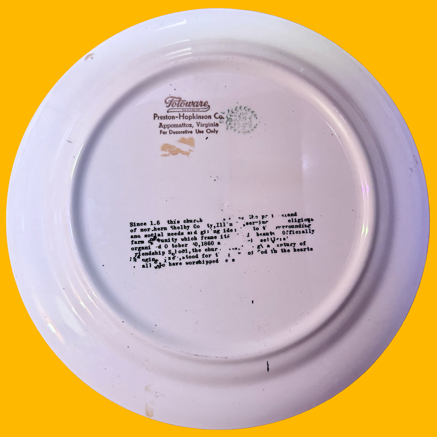 White ceramic plate with text on a yellow background