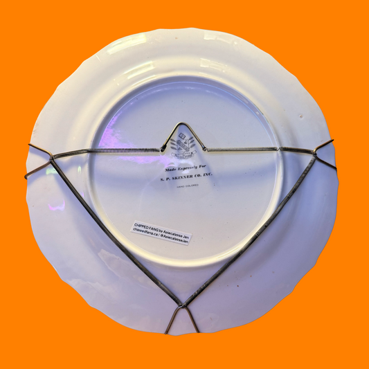 Back of the decorative plate, demonstrating the antique ire hanger that comes affixed/with it,