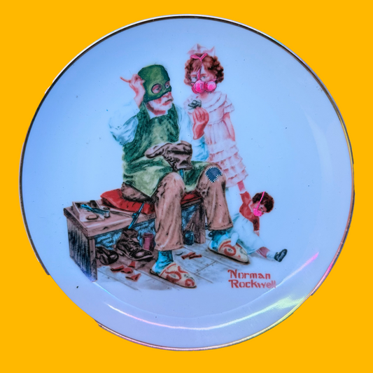 Decorative plate with a illustration of a man and girl painted to be wearing a balaclava and a gas mask (respectively) on a yellow background