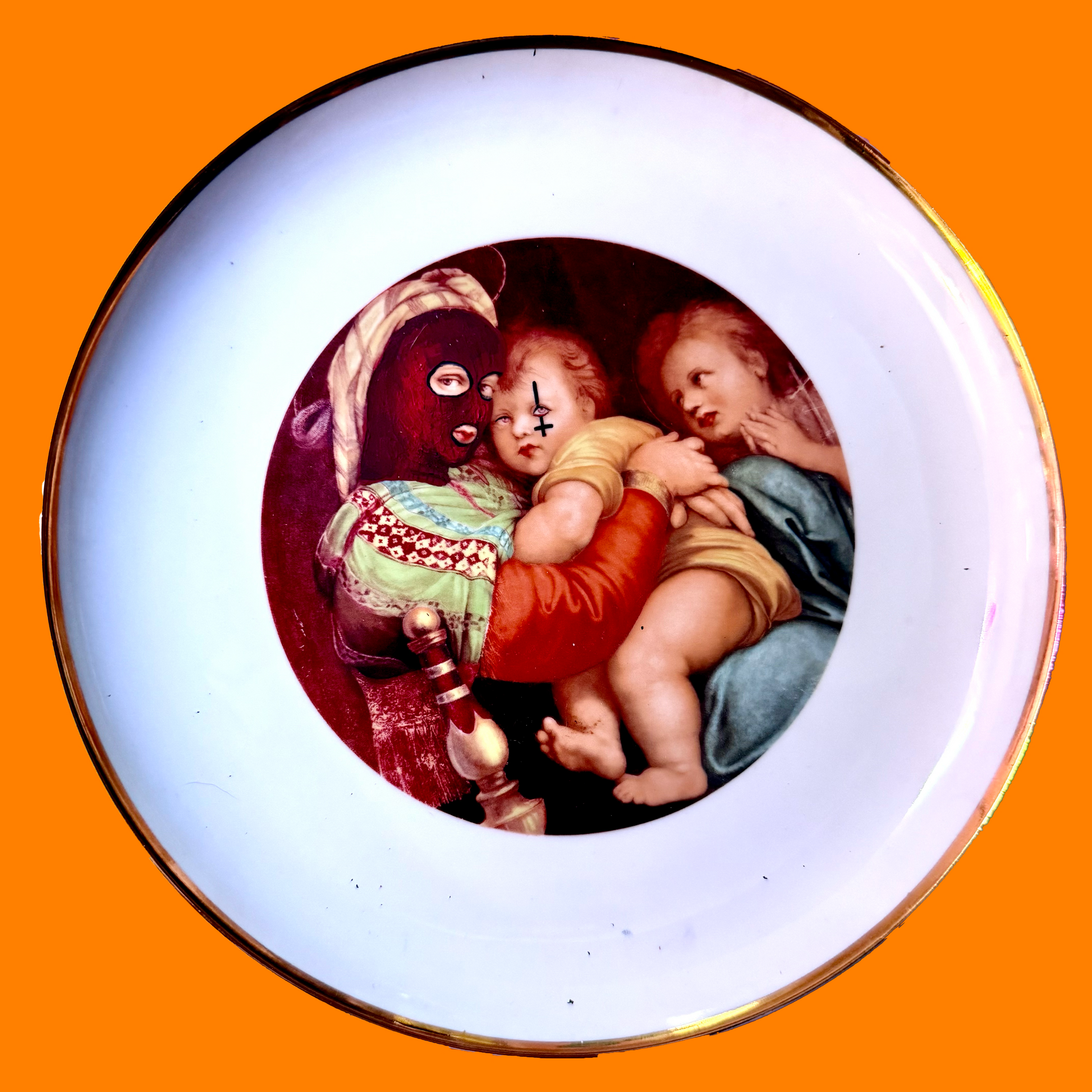 A decorative plate featuring the pieta, with Mary and baby Jesus. Painted to giv Mary a balaclava and Jesus a face tattoo. On orange background.