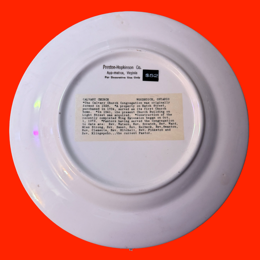 White plate back with text on a red background