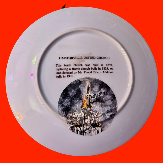 Decorative plate back with text and a church sticker on an orange background